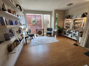 A Living Room Filled With Furniture And A Large Window